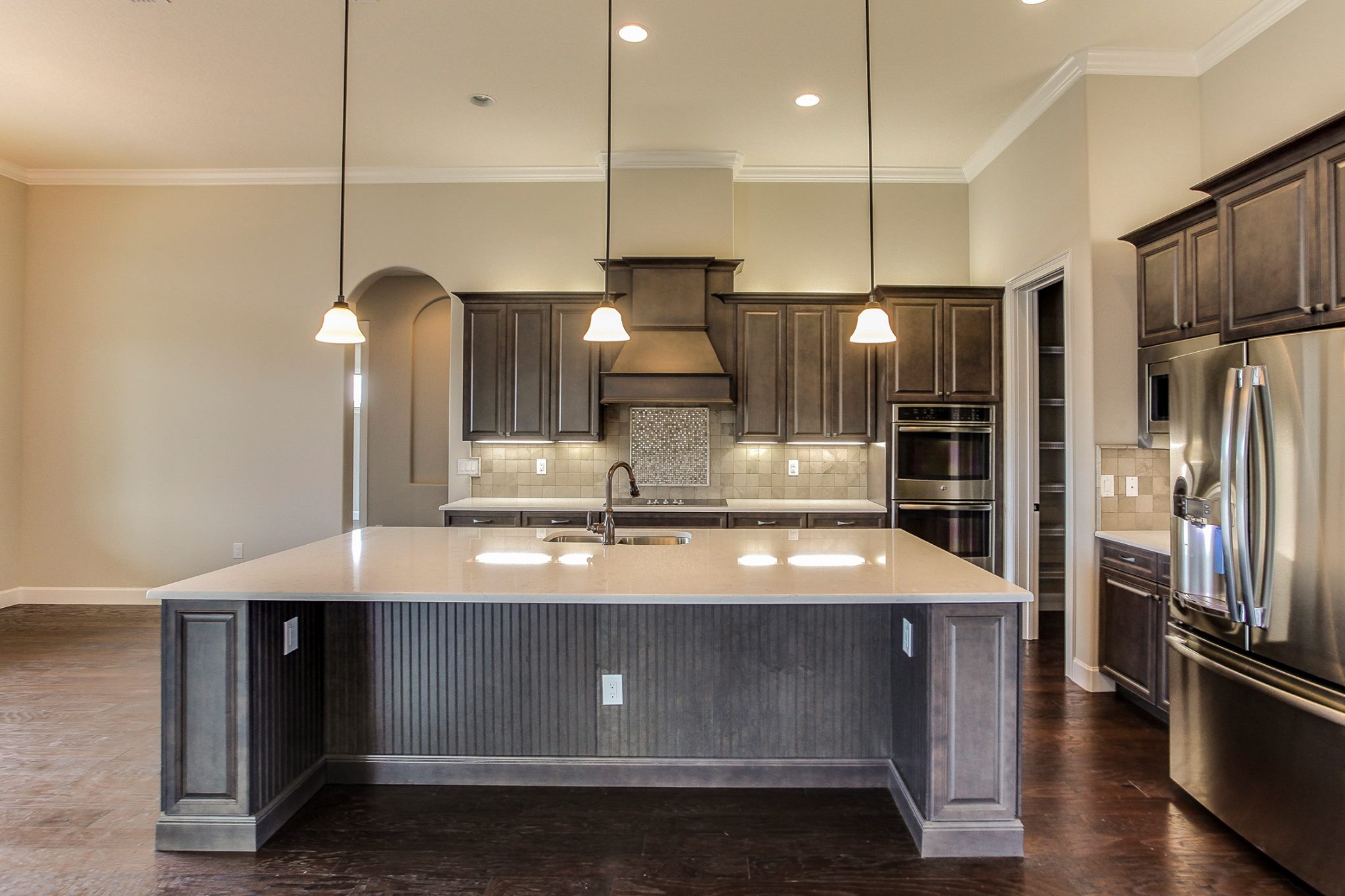 New Kitchen Construction with Marsh Cabinets, Stanisci Hood, and Cambria Countertops Hammond Kitchens & Bath Melbourne FL