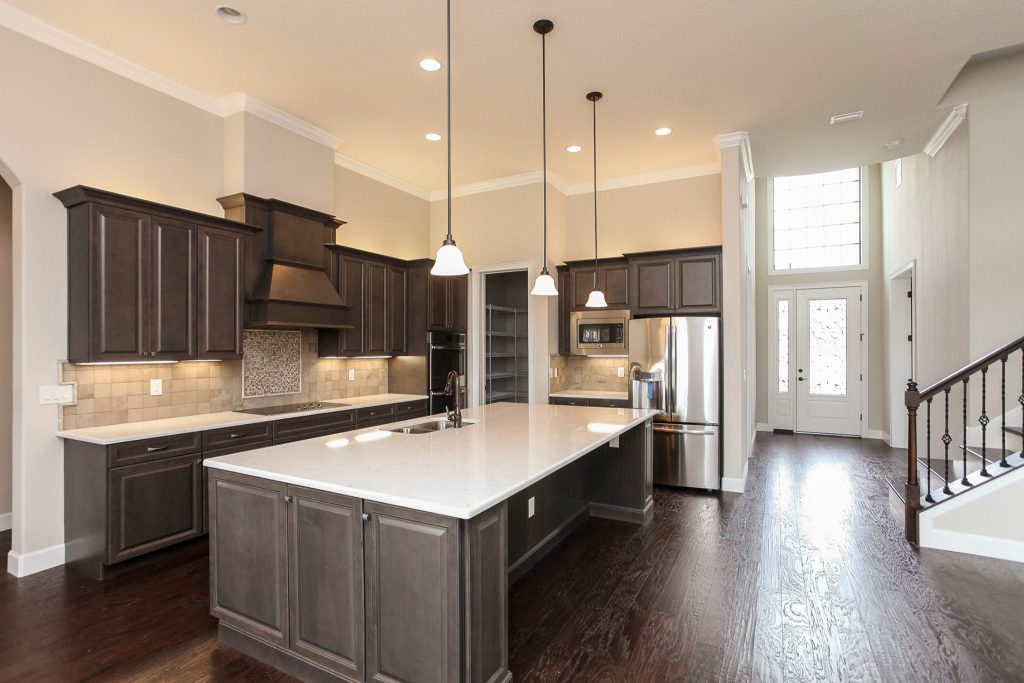 New Kitchen Construction with Marsh Cabinets, Stanisci Hood, and Cambria Countertops Hammond Kitchens & Bath Melbourne FL